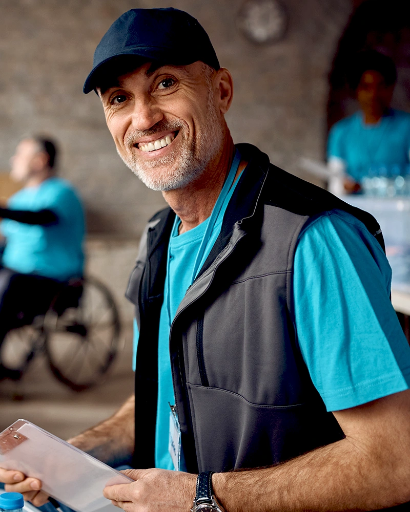 Mature Man Volunteering At Charitable Foundation