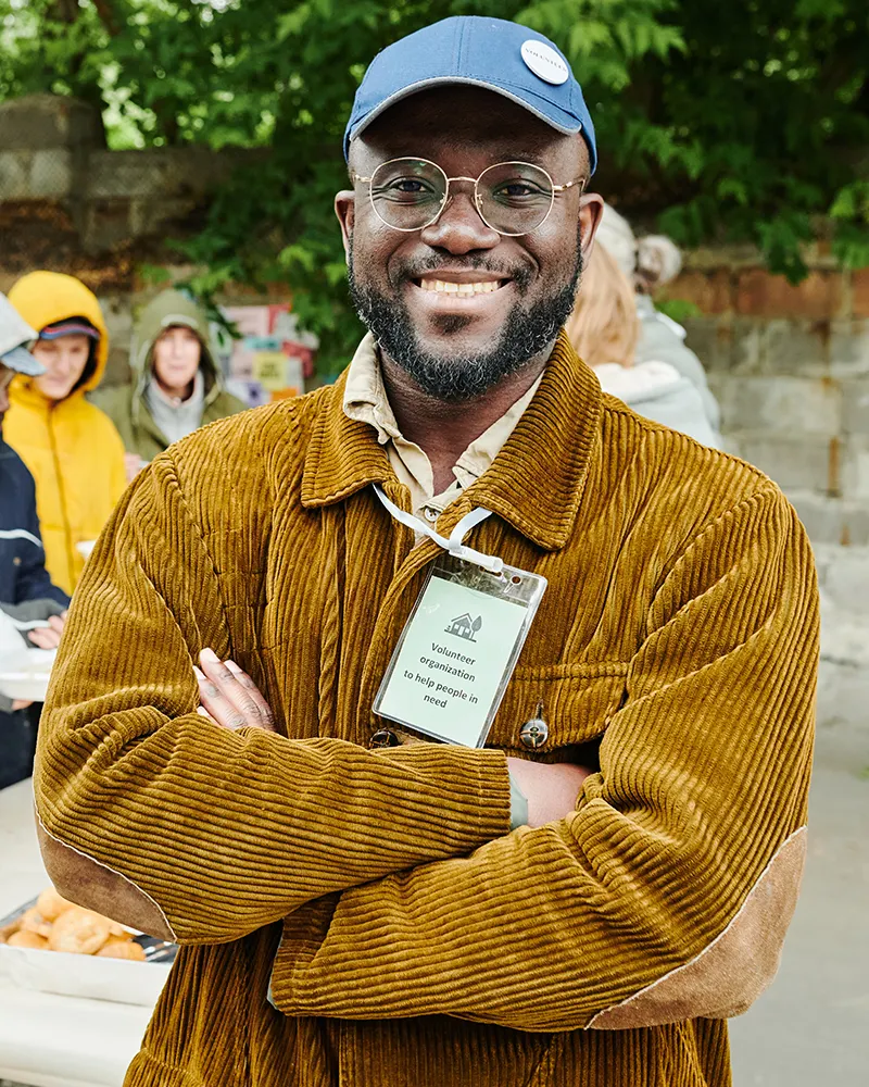 Volunteer Helping Homeless People Outdoors